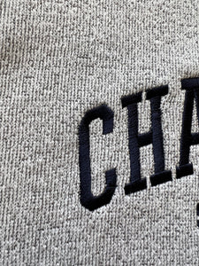 Detail view of embroidered crewneck sweatshirt in Light Steel with Navy thread